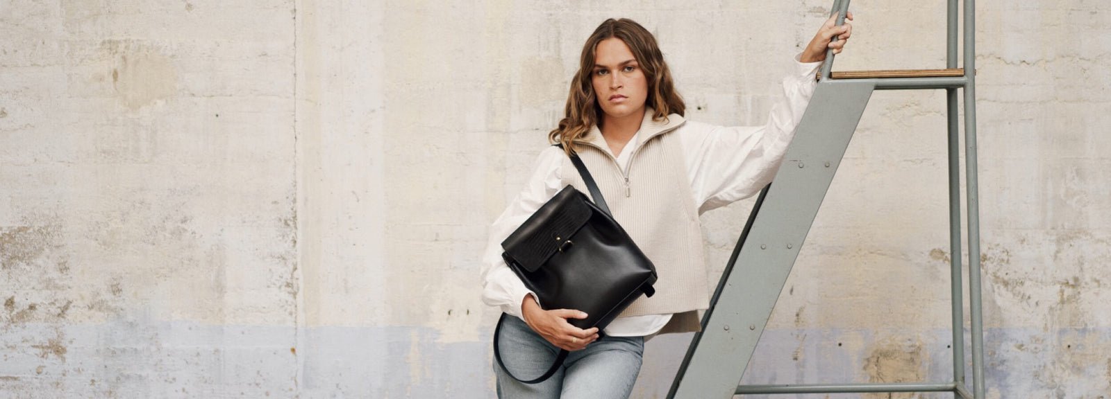 Black leather backpack campaign